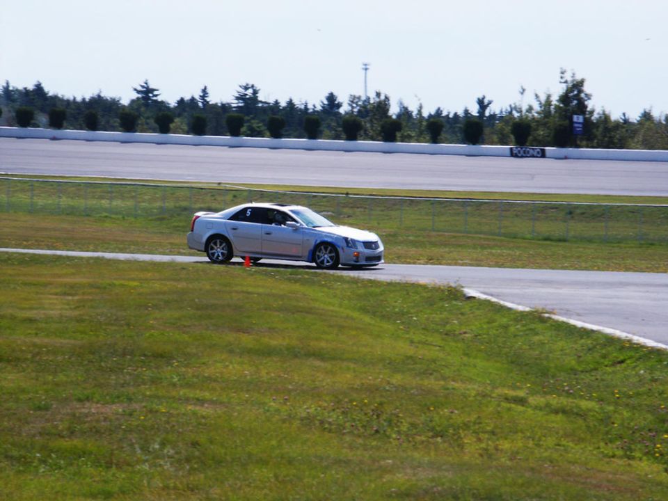 Silver Cadillac CTS-V on a race track