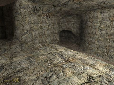 1969 Ford Mustang - The image shows the interior of a cave, with rough rock textures and a dark opening ahead.