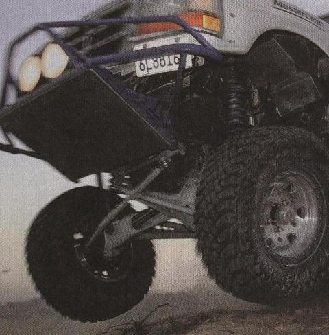 1984 Ford Bronco - Modified 1984 Ford Bronco with off-road tires and a custom front bumper.