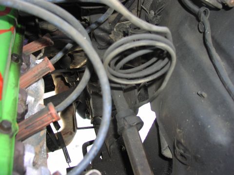 1979 Ford Bronco - Close-up view of engine components, including spark plug wires and hoses.
