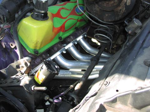 1979 Ford Bronco - Custom flame-painted valve cover and chrome headers are visible on this engine.