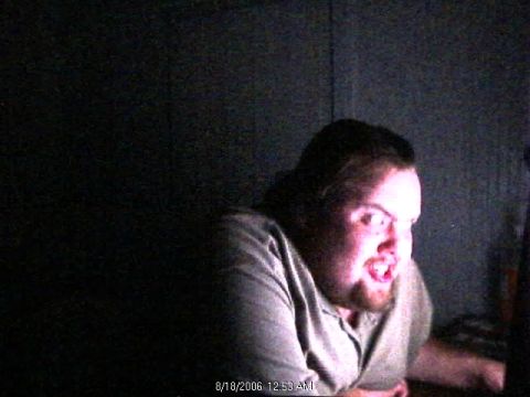 1985 Ford Crown Victoria LTD - A man is illuminated by a screen, with a timestamp visible in the corner of the image.