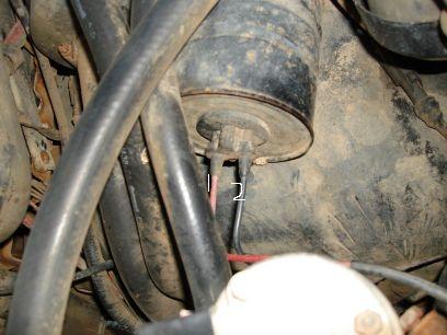 1993 Ford Bronco - Close-up view of engine compartment components, with a website watermark visible.