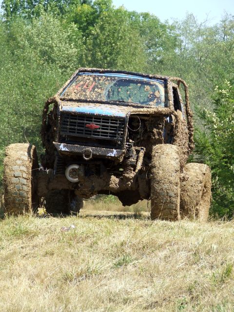 1977 Ford F-150 - This heavily modified off-road vehicle is covered in mud, obscuring its original make and model year.