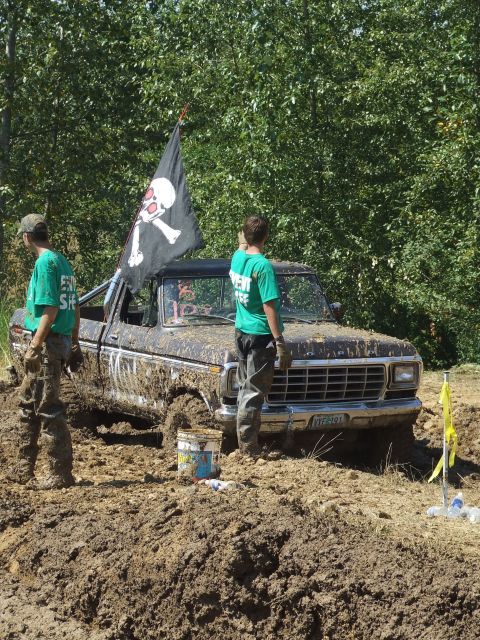 1977 Ford F-150 - This 1977 Ford F-150 is covered in mud, flying a pirate flag during a mud bog event.