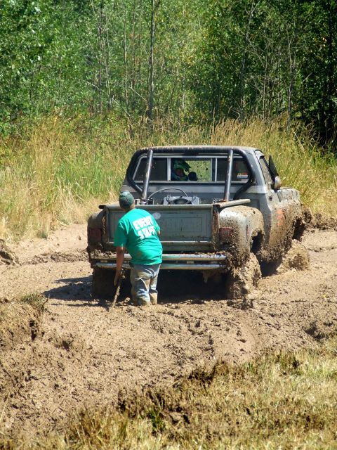 1977 Ford F-150 - A 1977 Ford F-150 navigates a muddy track during a mud bog event.