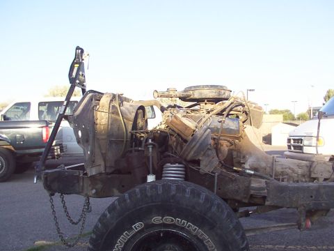 1978 Ford Bronco - This vehicle chassis and engine assembly is missing its body panels and is in a state of disrepair.