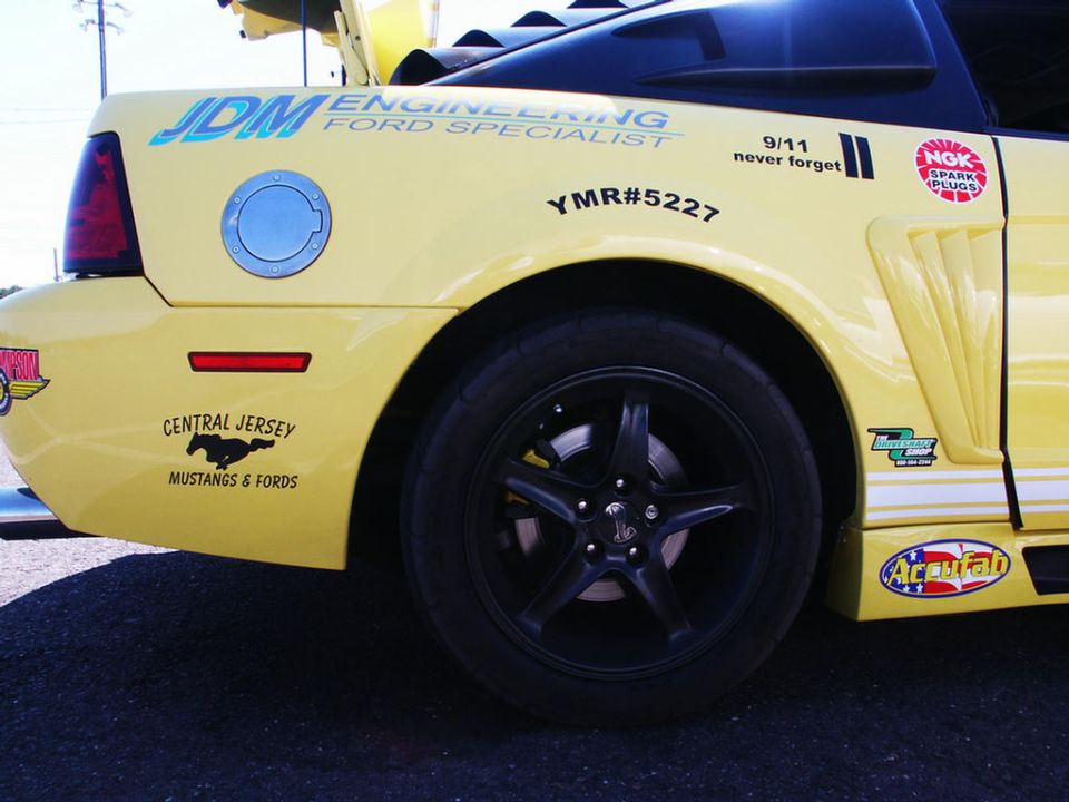 Yellow Ford Mustang rear quarter panel with JDM Engineering and Central Jersey Mustangs & Fords decals