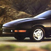 1991 Ford Probe - A black car is shown from the front three-quarter view, highlighting its wheel and front corner details.