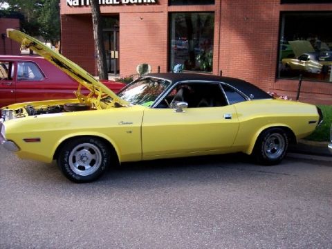 1972 Ford Ranchero - Yellow 1970 Dodge Challenger with hood open, parked on street next to red car.