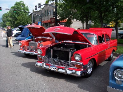 1972 Ford Ranchero - Classic cars on display with engines exposed.