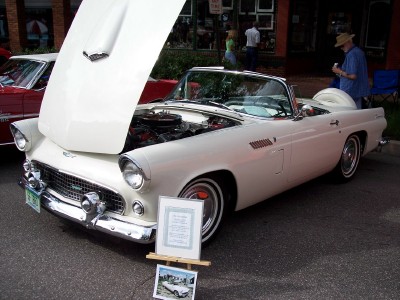1972 Ford Ranchero - A classic white convertible is displayed with its hood open, revealing the engine compartment.