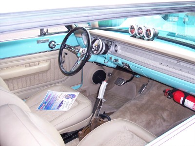 1972 Ford Ranchero - The interior of the vehicle features aftermarket gauges and a fire extinguisher mounted on the passenger side floor.