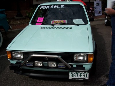 1972 Ford Ranchero - Light blue Volkswagen Rabbit pickup truck with "FOR SALE" sign in the windshield and a bull bar on the front.