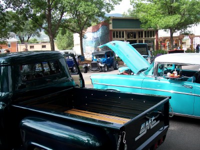 1972 Ford Ranchero - A collection of classic vehicles are displayed outdoors, with a turquoise car and a blue truck prominently featured.