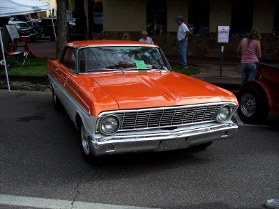 1972 Ford Ranchero - A two-tone orange and silver 1964 Ford Falcon Ranchero is parked on a street.