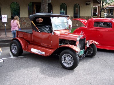 1972 Ford Ranchero - A classic pickup truck is parked on the street, with another custom car visible behind it.