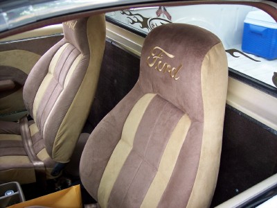 1972 Ford Ranchero - The interior features custom seats with a prominent Ford logo embroidered on the headrests.