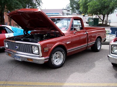 1972 Ford Ranchero - 1971 Chevrolet C10 pickup truck with its hood open, parked next to another vehicle.