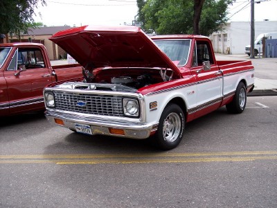 1972 Ford Ranchero - This pickup truck, likely a 1971 Chevrolet C/K, is displayed with its hood up, revealing the engine compartment.