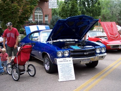 1972 Ford Ranchero - A blue 1970 Chevelle SS is displayed with its hood open, alongside another car at an outdoor event.
