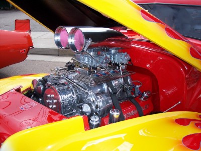 1972 Ford Ranchero - Engine bay of a custom vehicle with a prominent supercharger and flame paintwork.