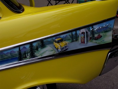 1972 Ford Ranchero - A custom mural depicts a vintage car at a gas station on the side of a yellow vehicle.