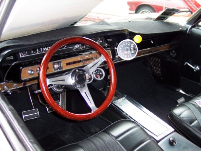 1972 Ford Ranchero - The dashboard features a large tachometer and wood grain trim, with a glimpse of another vehicle outside.