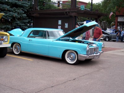 1972 Ford Ranchero - A blue 1956 Lincoln Continental Mark II coupe is displayed with its hood open.
