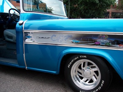 1972 Ford Ranchero - Blue pickup truck side with chrome trim and 'Cameo Carrier' graphic. BFGoodrich Radial T/A tire visible.