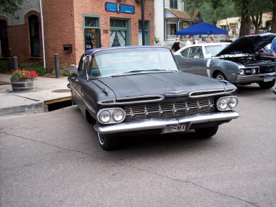 1972 Ford Ranchero - A dark gray 1959 Chevrolet El Camino is parked on a street, with another vehicle visible behind it.