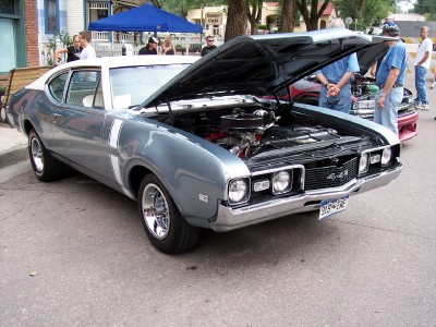 1972 Ford Ranchero - A light blue and white coupe with its hood open, displaying the engine compartment.