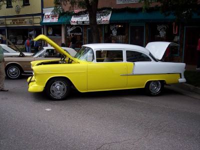 1972 Ford Ranchero - Two-tone 1955 Chevrolet Bel Air sedan on display with hoods open.