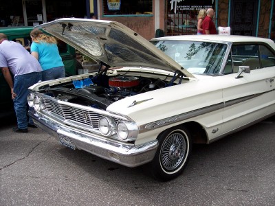 1972 Ford Ranchero - White 1964 Ford Galaxie 500 coupe with its hood open, revealing the engine bay.