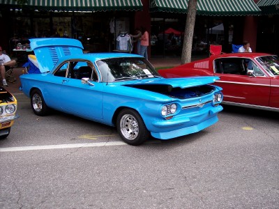 1972 Ford Ranchero - Blue 1965 Chevrolet Corvair coupe on display, hood and trunk open.
