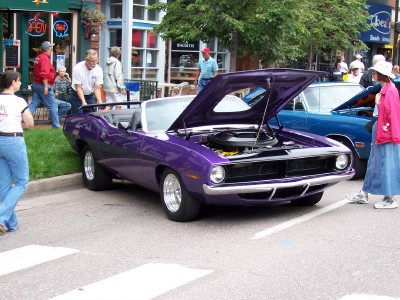 1972 Ford Ranchero - Purple 1970 Plymouth Barracuda convertible on display with its hood open.