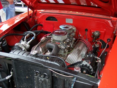 1972 Ford Ranchero - Close-up of a V8 engine bay, chrome air cleaners and red spark plug wires.