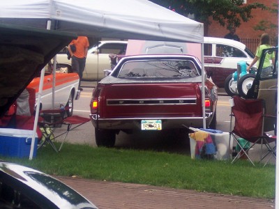 1972 Ford Ranchero - Rear view of a red 1972 Ford Ranchero pickup truck at an outdoor event.