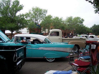 1972 Ford Ranchero - Turquoise and white 1957 Chevrolet Bel Air parked at an outdoor event with other vehicles.