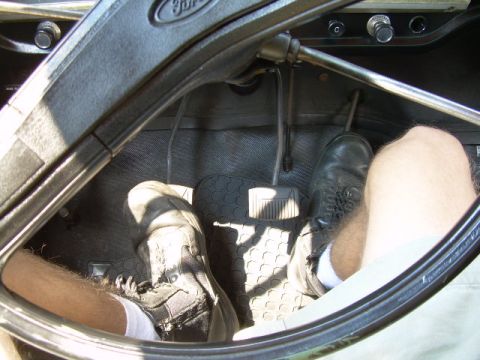 1971 Ford F-100 - Driver's perspective inside a 1971 Ford F-100, focusing on the floor pedals and steering column.