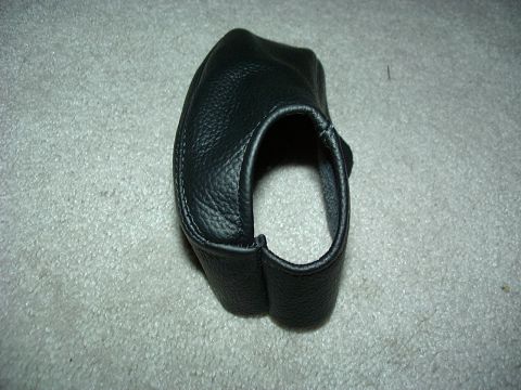 1995 Ford Probe - A black leather shift boot is shown on a carpeted surface. The SuperMotors logo is visible in the lower right corner.