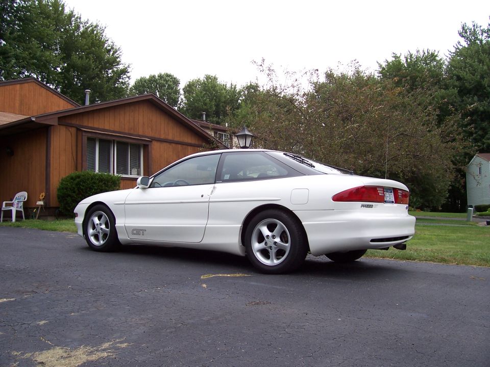 White 1993 Ford Probe GT parked in driveway, side view