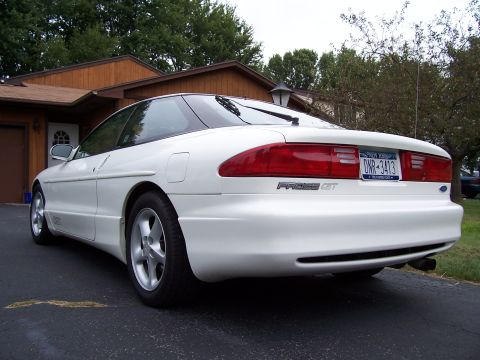 1993 Ford Probe - Rear view of a white 1993 Ford Probe GT, showing its distinctive taillights and badging.