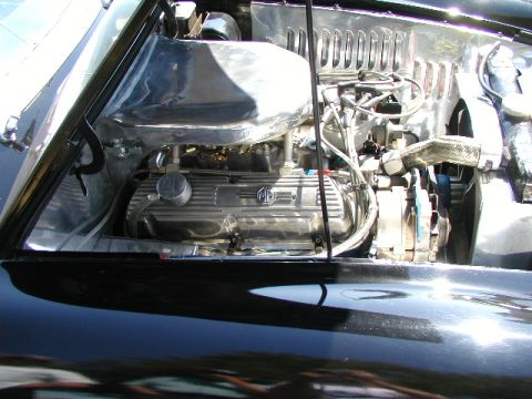 1967 Ford Ranchero - Custom V8 engine with chrome accents and MG branding in an engine bay.