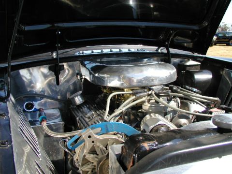 1967 Ford Ranchero - Close-up view of a modified V8 engine, custom chrome and polished aluminum parts under the hood.