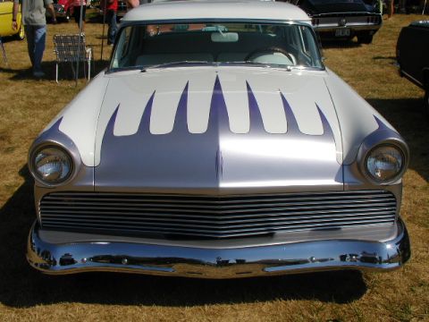 1967 Ford Ranchero - A classic car with custom flame paintwork is displayed outdoors on a sunny day.