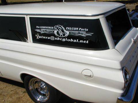 1967 Ford Ranchero - White 1960s Ford Falcon/Ranchero wagon shows "The Godfather FALCON Parts" sticker on rear window.