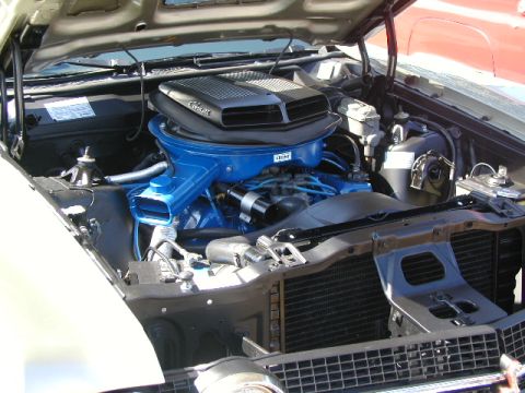 1967 Ford Ranchero - The engine bay of a 1970 Ford Torino GT is shown with its hood open, revealing the V8 engine.