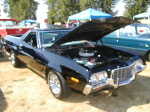 1967 Ford Ranchero - Black 1970 Ford Ranchero with hood open at an outdoor car show.