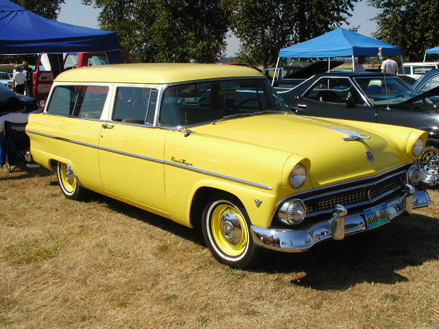Yellow station wagon with white roof and trim, chrome bumpers, and whitewall tires. License plate reads '808 ABH'